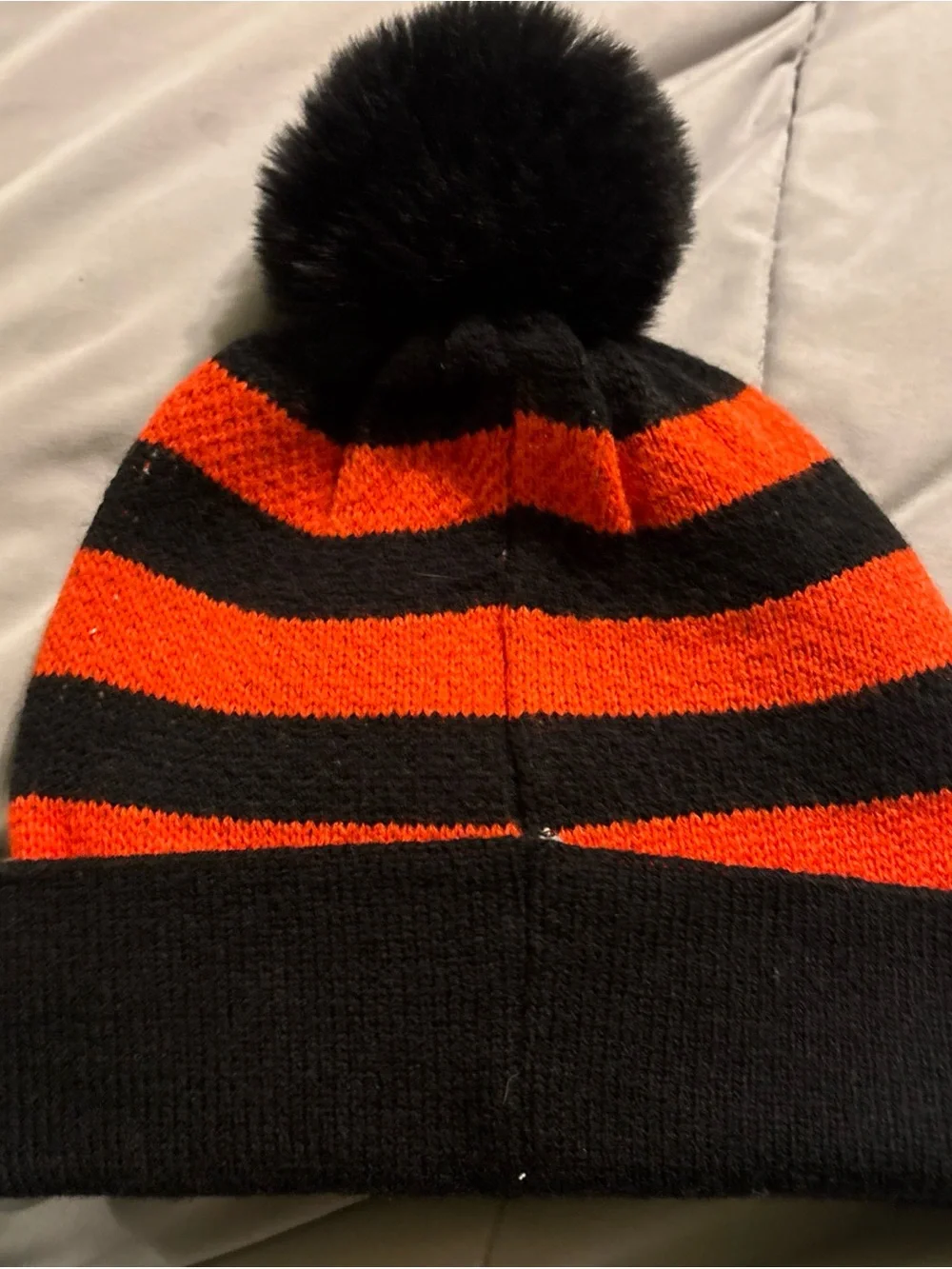 Black & Orange Pom Pom Skull Beanie